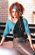 Turquoise Suede top with black leather bib and grey skirt.